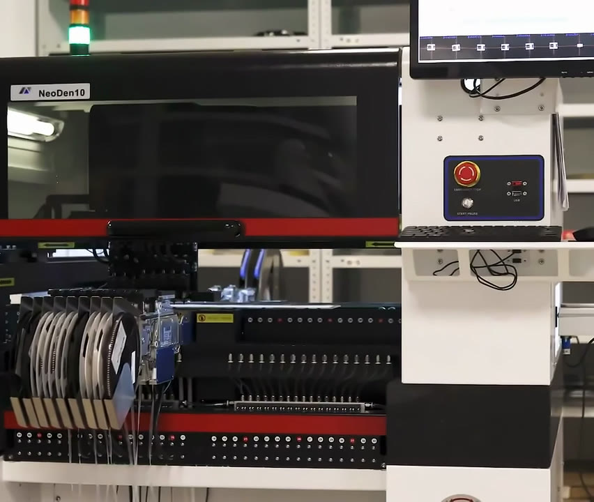 NeoDen pick-and-place machine with component reels loaded on the PCB assembly line